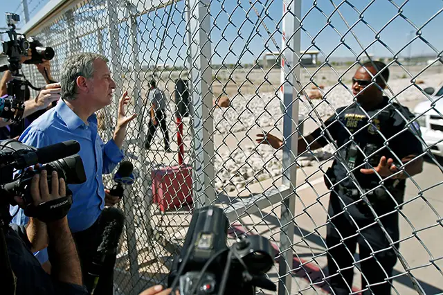 An agent with the Department of Homeland Security denies access to New York City Mayor Bill de Blasio to the holding facility for immigrant children in Tornillo, Texas, near the Mexican border in June 2018.